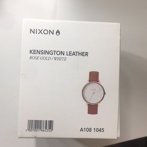 Nixon women rose gold/white watch